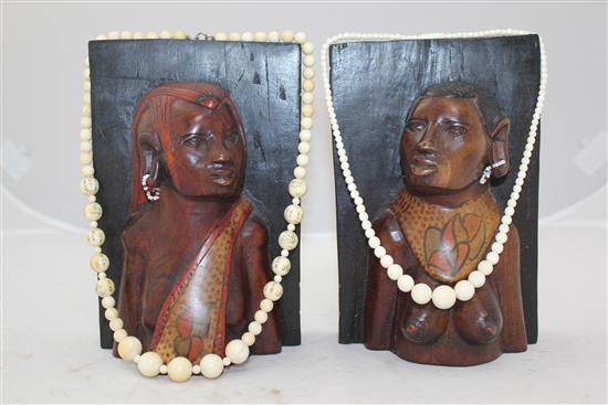 Ivory elephant on stand, a pair of bookends and two ivory bead necklaces